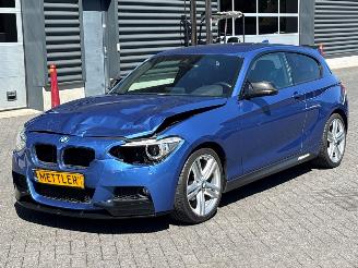 Damaged car BMW 1-serie 114i 1.6 16V Hatchback 2Dr Benzine 1.598cc 75kW (102pk) RWD 2012/11