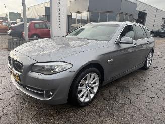 Vaurioauto  passenger cars BMW 5-serie Touring 520d High Executive 2011/12