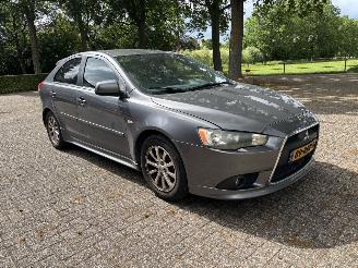 Vaurioauto  passenger cars Mitsubishi Lancer 1.6i edition two 2011/4