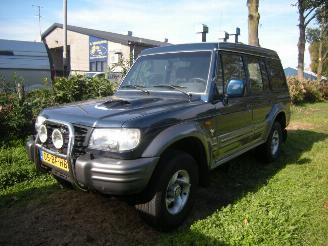 skadebil auto Hyundai Galloper 2.5 TCI High Roof exceed uitvoering met oa airco, 4wd enz 2002/8