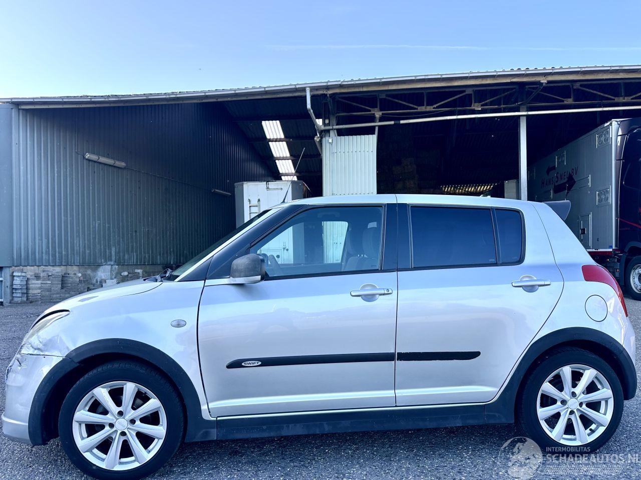 Suzuki Swift 1.3i 92pk GLS 5drs - nap - airco - camera - touchscreen multimedia - bleutooth - alcantara hemel + stuur