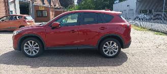 damaged passenger cars Mazda CX-5 2.2 175pk Automatik 4x4 Navigatie Xenon Climatecontrol CruiseControl Stoelverwarming Lichtautomaat Privacyglas Regensensor Achteruitrijcamera Keyless entry 2014/7