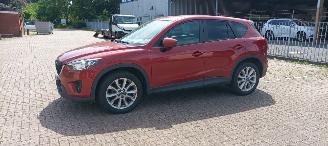Coche accidentado Mazda CX-5 4x4 Navigatie Bose Soundsystem Xenon Leren Sportstoelen-Memory Climatecontrol CruiseControl Stoelverwarming Lichtautomaat Privacyglas keyless Entry trekhaak Parkeersensoren Achteruitrijcamera 2014/7