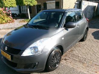Vaurioauto  passenger cars Suzuki Swift 1.2 COMFORT 4X4 AIRCO 2012/6