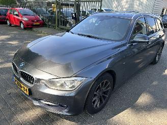 Schadeauto BMW 3-serie 320i  Touring High Executive  Automaat 2014/11